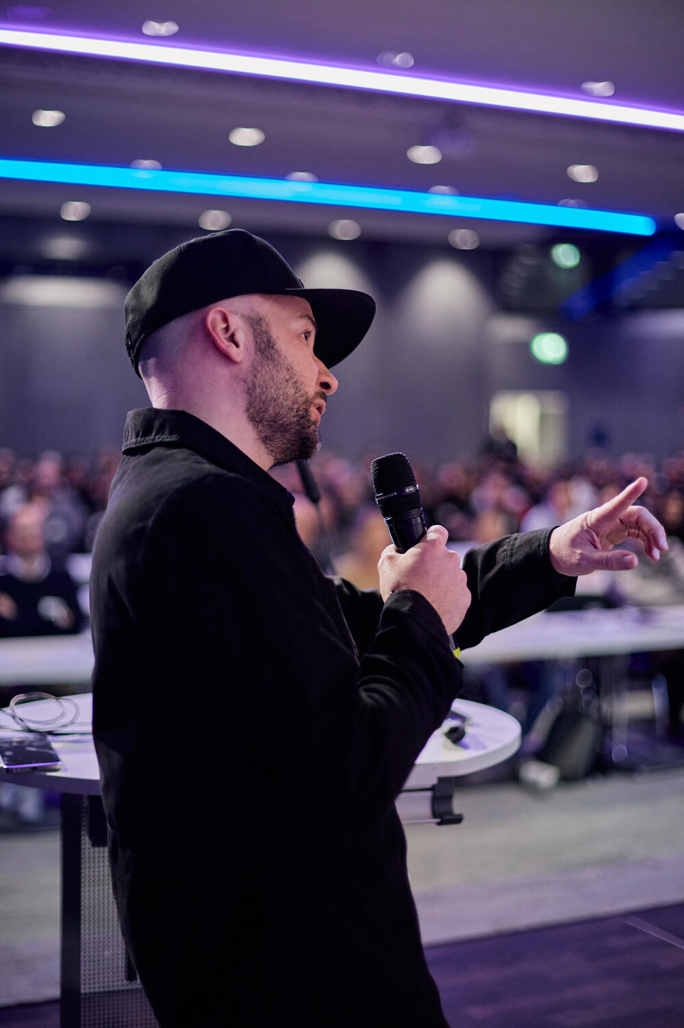 Alex on stage talking about user interface design and user experience